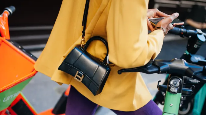 What Is A Masculine Way to Hold A Woman's Bag